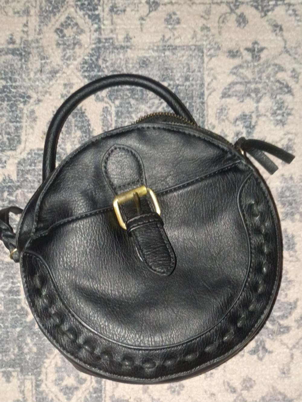 Black Round Leather Crossbody Bag with Top Handle and Gold Buckle